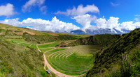 Panorama of terraces at Moray, Peru with Andes
